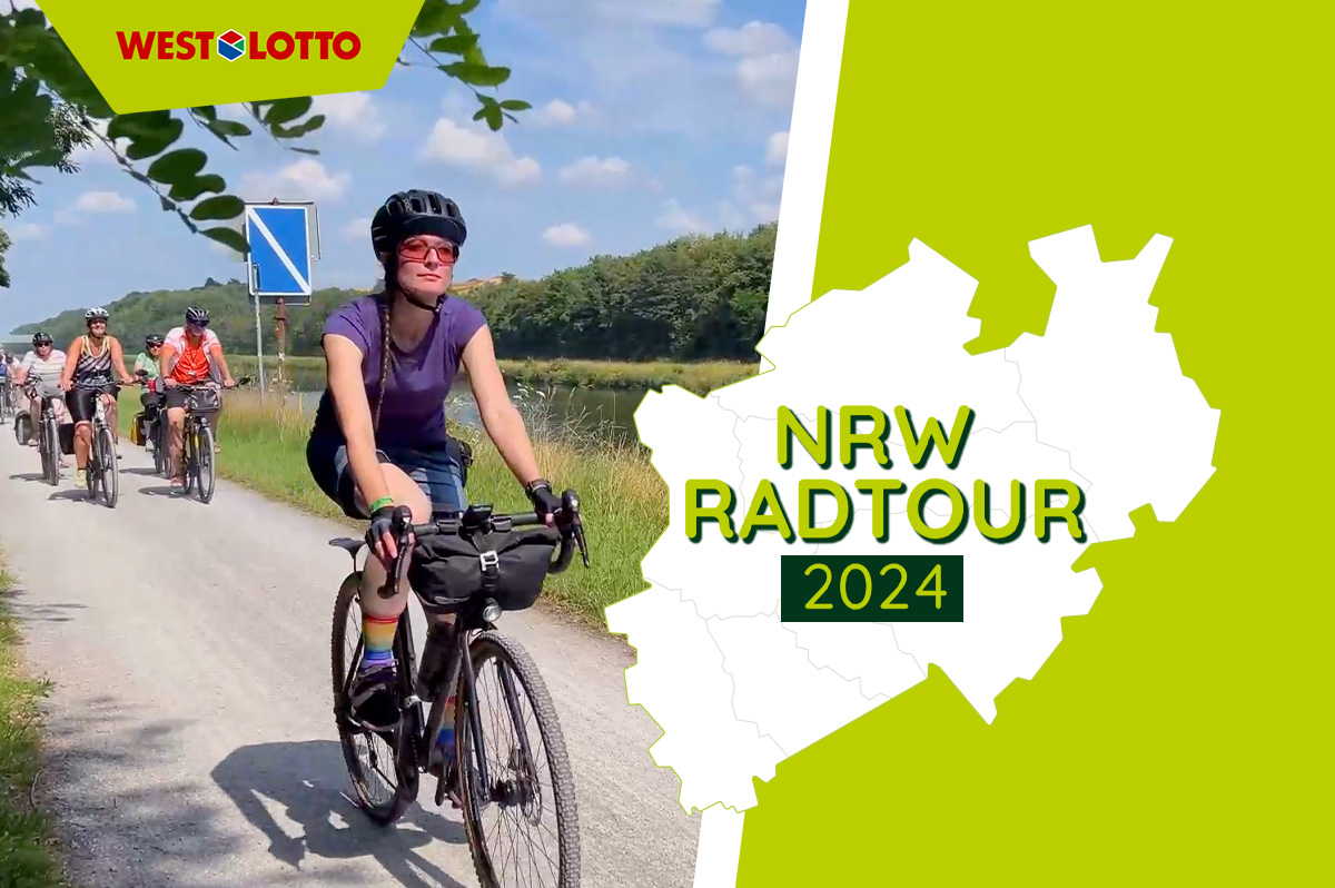 Frau auf dem Fahrrad bei der NRW Radtour von WestLotto